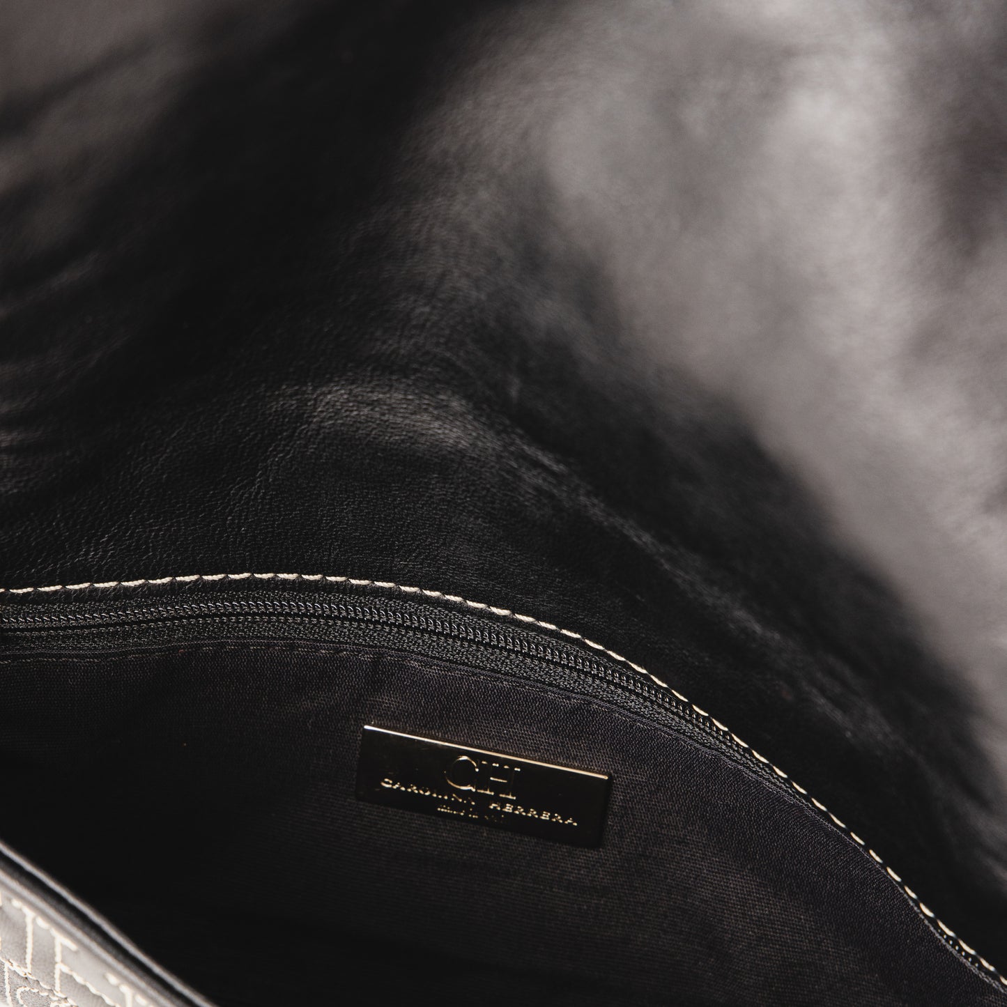 CH leather clutch